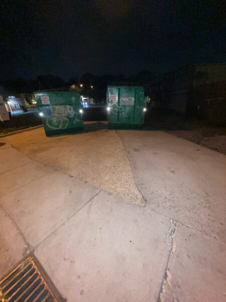This project involved pressure washing a Chattanooga restaurant's front sidewalk, customer patio, and dumpster area using a municipal fire hydrant water source to remove dirt, stains, and grease for a cleaner appearance.