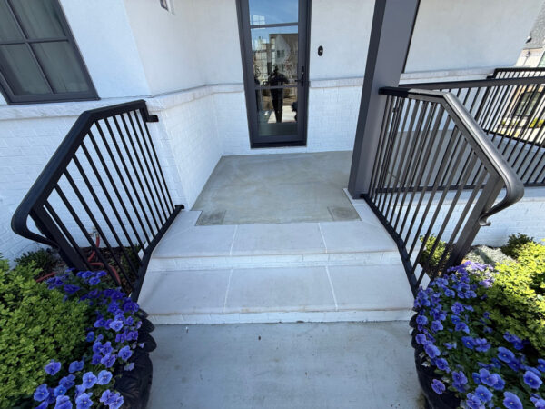 Professional cleaning of the driveway, front porch, and steps in Chattanooga was completed using power rinsing, specialized detergents, and surface washing to remove organic buildup and embedded dirt.