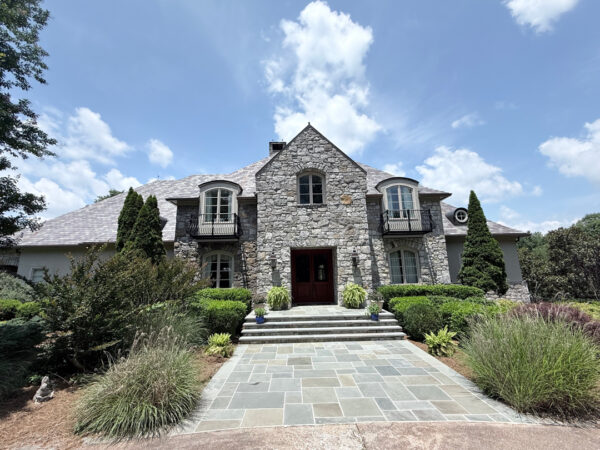 This project involved a comprehensive soft wash and power rinse of a two-story residence in Signal Mountain, including its siding, pool deck, stone fireplace, metal fencing, patio furniture, and multi-level brick, stone, and wood patios to remove mold, mildew, and environmental buildup.