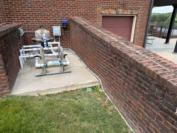 This comprehensive exterior restoration in Soddy-Daisy utilized professional soft-wash and pressure washing techniques to clean the home's siding, concrete surfaces, pool deck, three wood decks, patio furniture, retaining walls, and both interior and exterior windows.