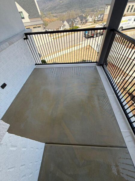 Professional cleaning of the driveway, front porch, and steps in Chattanooga was completed using power rinsing, specialized detergents, and surface washing to remove organic buildup and embedded dirt.