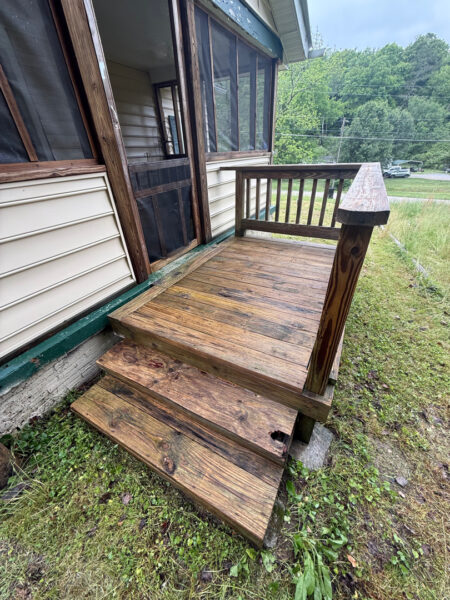 This project involved a comprehensive low-pressure soft wash of a single-story home's exterior surfaces, including siding, trim, and gutters, to remove organic growth and restore a uniform appearance.