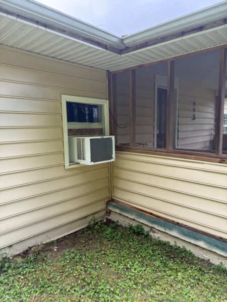 This project involved a comprehensive low-pressure soft wash of a single-story home's exterior surfaces, including siding, trim, and gutters, to remove organic growth and restore a uniform appearance.