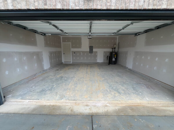 The project involved a comprehensive exterior rinse of a newly constructed home in Chattanooga, including the siding, garage, driveway, and walkways, to remove construction dust and debris for a move-in-ready finish.