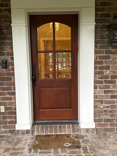 This project involved a comprehensive soft wash and detailed exterior cleaning of a Chattanooga residence, encompassing the house, porches, concrete surfaces, gutters, and outbuildings to remove organic buildup and restore a uniform appearance.