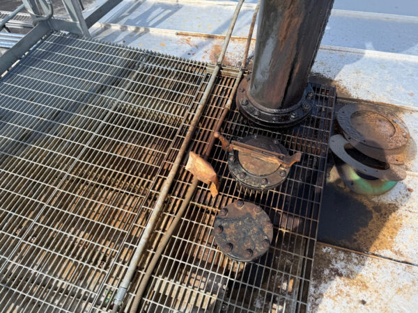 This project involved the complete cleaning and surface preparation of two industrial storage tanks' tops and upper walls using a 40-foot electric lift, pressure washing, and specialized detergents to remove mold, mildew, and dirt.