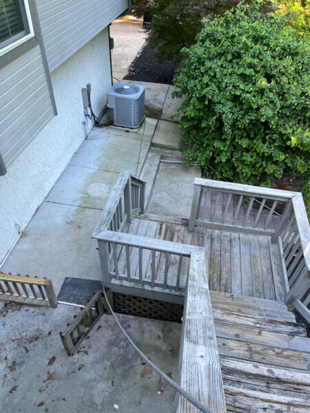 This comprehensive exterior cleaning project involved a full soft wash of the home's surfaces, a dedicated pressure wash of concrete hardscapes and retaining walls, and a gentle cleaning of the wood deck and mailbox to remove organic growth and restore the property's appearance.