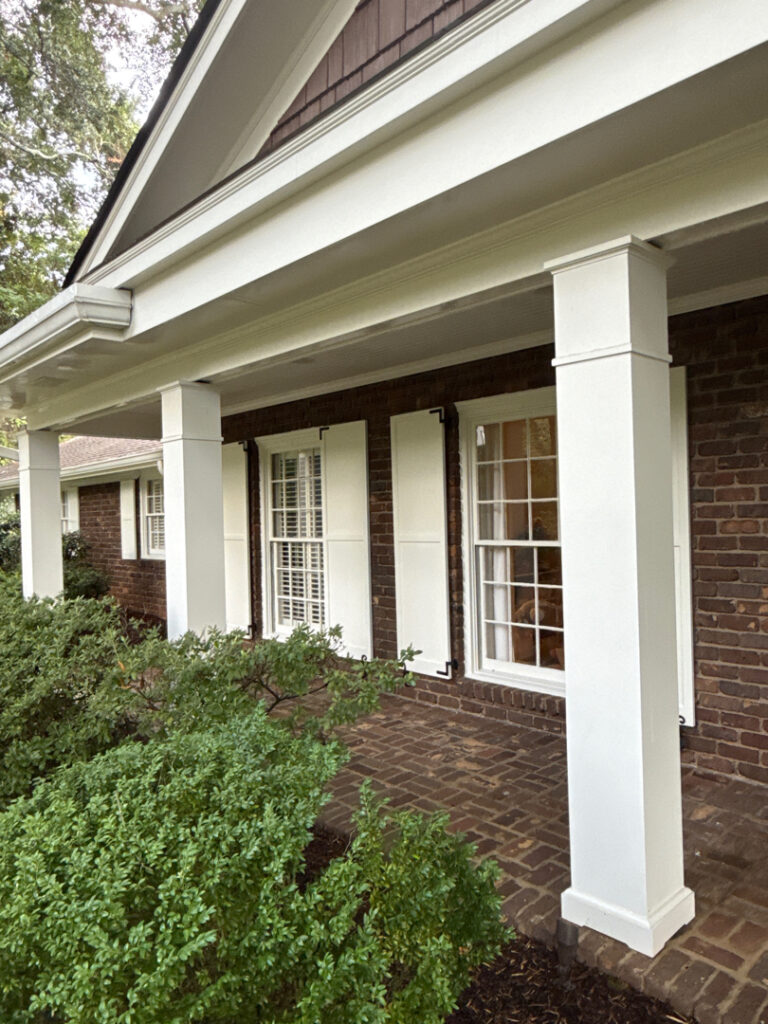 This project involved a comprehensive soft wash and detailed exterior cleaning of a Chattanooga residence, encompassing the house, porches, concrete surfaces, gutters, and outbuildings to remove organic buildup and restore a uniform appearance.