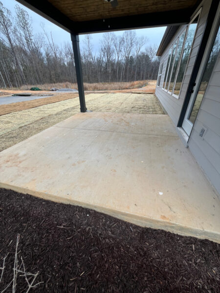 The project involved a comprehensive exterior rinse of a newly constructed home in Chattanooga, including the siding, garage, driveway, and walkways, to remove construction dust and debris for a move-in-ready finish.