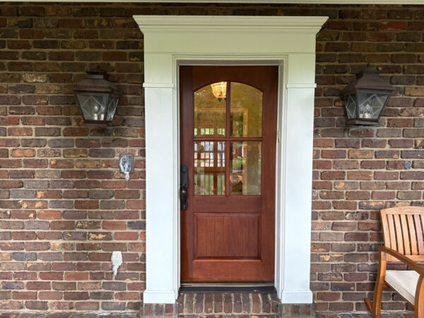 This project involved a comprehensive soft wash and detailed exterior cleaning of a Chattanooga residence, encompassing the house, porches, concrete surfaces, gutters, and outbuildings to remove organic buildup and restore a uniform appearance.