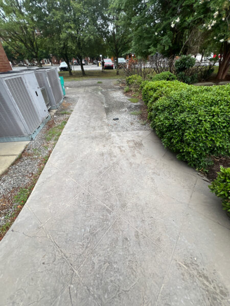 The project at Urban Stack in Chattanooga involved inspecting and thoroughly pressure washing the restaurant's exterior sidewalks, dining patios, and side entrance to remove dirt, stains, and grease, thereby restoring a clean appearance and improving pedestrian safety.