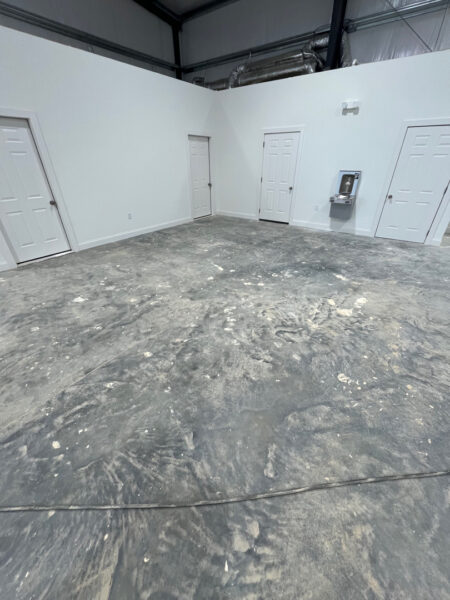 A cleaning of this metal warehouse to remove built-up dirt, grime, and surface staining was done, leaving the slab noticeably cleaner, brighter, and more professional-looking. The wash improved the overall appearance of the space while helping reduce slick residue and making the floor easier to maintain going forward.