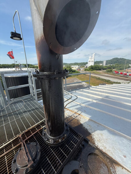 This project involved the complete cleaning and surface preparation of two industrial storage tanks' tops and upper walls using a 40-foot electric lift, pressure washing, and specialized detergents to remove mold, mildew, and dirt.