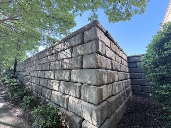 This project in Chattanooga utilized specialized soft wash and surface cleaning techniques to remove organic growth and contaminants from a retaining wall and street light concrete bases while preserving the structural integrity of the masonry.