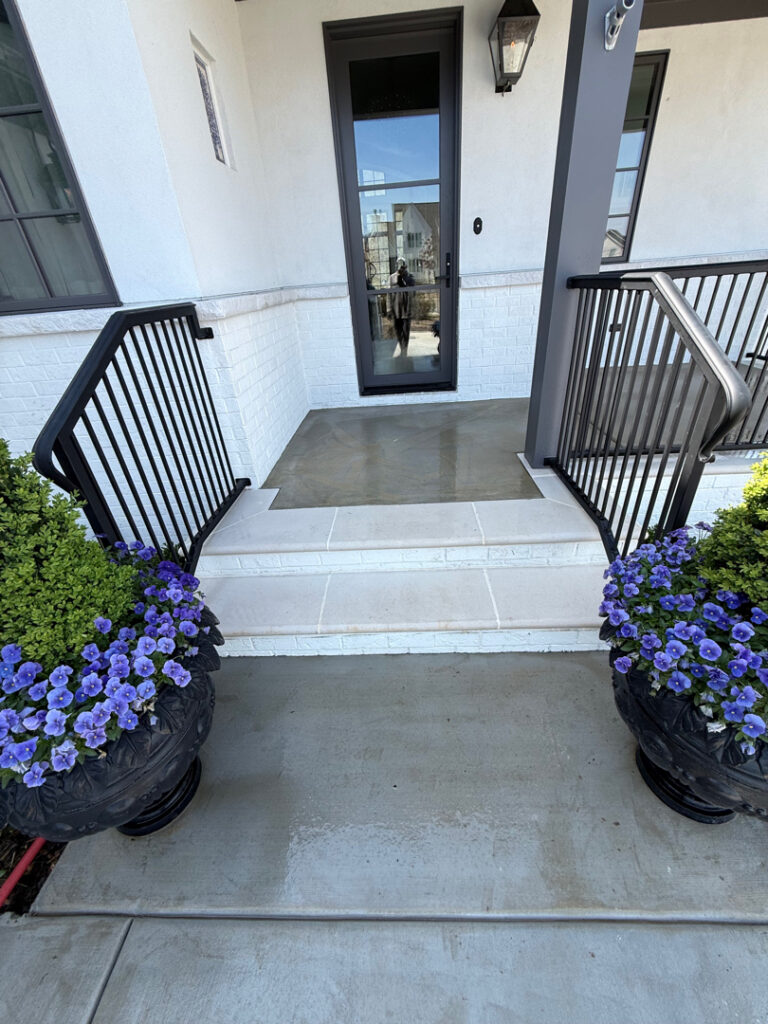 Professional cleaning of the driveway, front porch, and steps in Chattanooga was completed using power rinsing, specialized detergents, and surface washing to remove organic buildup and embedded dirt.