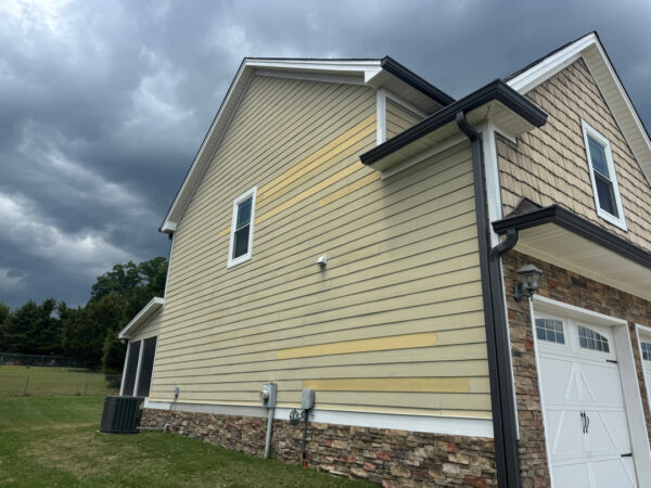 This project involved a comprehensive soft wash of a two-story residence in Ringgold to remove organic buildup from all exterior surfaces and prepare the screened porch for painting.