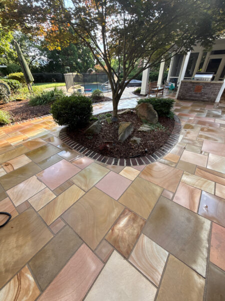 This project involved a comprehensive soft wash and detailed exterior cleaning of a Chattanooga residence, encompassing the house, porches, concrete surfaces, gutters, and outbuildings to remove organic buildup and restore a uniform appearance.