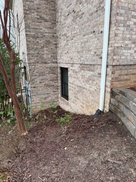 The work performed consists of soft washing and rinsing the primary structure's exterior surfaces, three rear decks, a treehouse with its decks and bridges, and surface cleaning the concrete flatwork, all backed by a one-year warranty against mold and mildew regrowth.