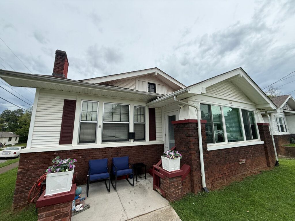 This project involved a comprehensive soft wash of a two-story Chattanooga residence and its wood deck, utilizing low-pressure detergent applications to safely and effectively remove organic growth, dirt, and stains from all exterior surfaces.
