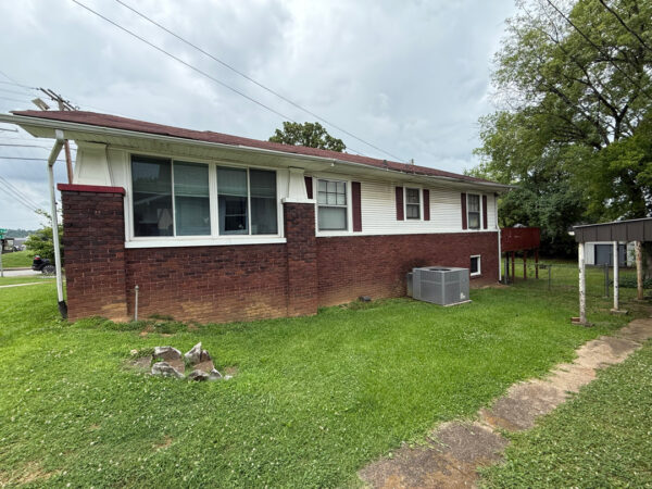 This project involved a comprehensive soft wash of a two-story Chattanooga residence and its wood deck, utilizing low-pressure detergent applications to safely and effectively remove organic growth, dirt, and stains from all exterior surfaces.