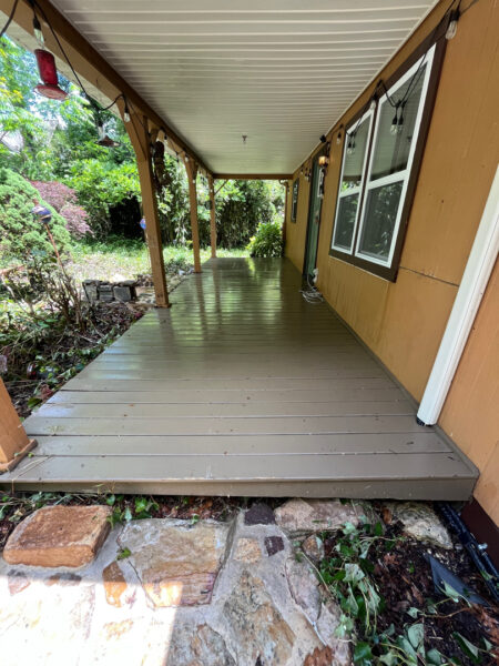 This project involved the soft washing of a one-story residence's exterior, its driveway and walkway pavers, and a stone fountain, alongside the cleaning of a commercial metal roof, to remove organic growth and restore the appearance of all surfaces in McDonald.