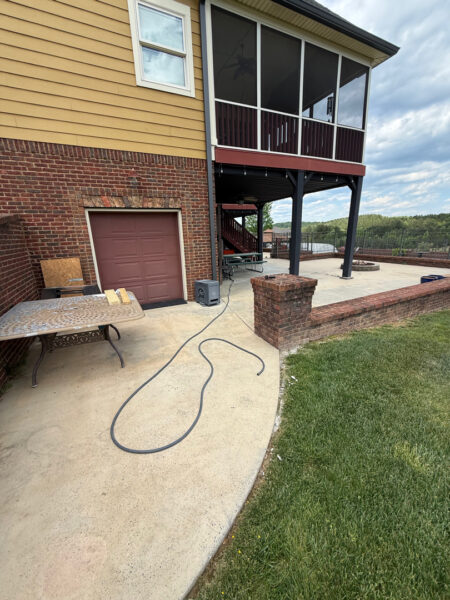 This comprehensive exterior restoration in Soddy-Daisy utilized professional soft-wash and pressure washing techniques to clean the home's siding, concrete surfaces, pool deck, three wood decks, patio furniture, retaining walls, and both interior and exterior windows.
