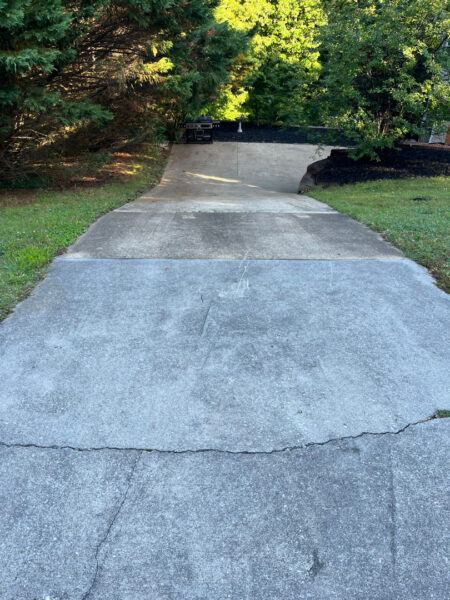 This comprehensive exterior cleaning project involved a full soft wash of the home's surfaces, a dedicated pressure wash of concrete hardscapes and retaining walls, and a gentle cleaning of the wood deck and mailbox to remove organic growth and restore the property's appearance.