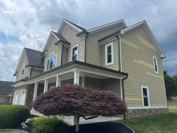 This project involved a comprehensive soft wash of a two-story residence in Ringgold to remove organic buildup from all exterior surfaces and prepare the screened porch for painting.