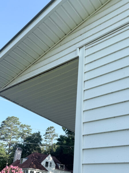 The contractor performed a comprehensive exterior cleaning in Chickamauga, utilizing soft washing for the home and workshop siding and professional surface cleaning for all concrete driveways, walkways, and patios.