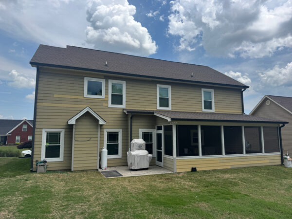 This project involved a comprehensive soft wash of a two-story residence in Ringgold to remove organic buildup from all exterior surfaces and prepare the screened porch for painting.