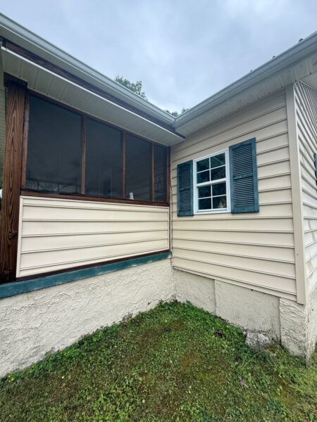 This project involved a comprehensive low-pressure soft wash of a single-story home's exterior surfaces, including siding, trim, and gutters, to remove organic growth and restore a uniform appearance.