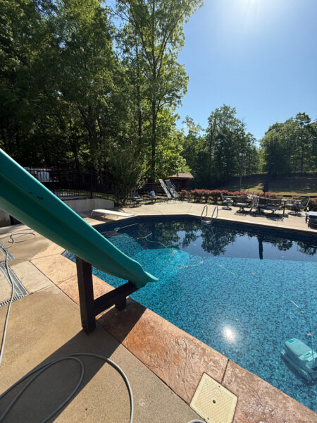 This project involved a comprehensive exterior cleaning of a Cleveland outdoor living space, utilizing specialized detergents and soft-wash techniques to remove pet hair, organic growth, and grime from a concrete pool deck and a multi-level wood deck.
