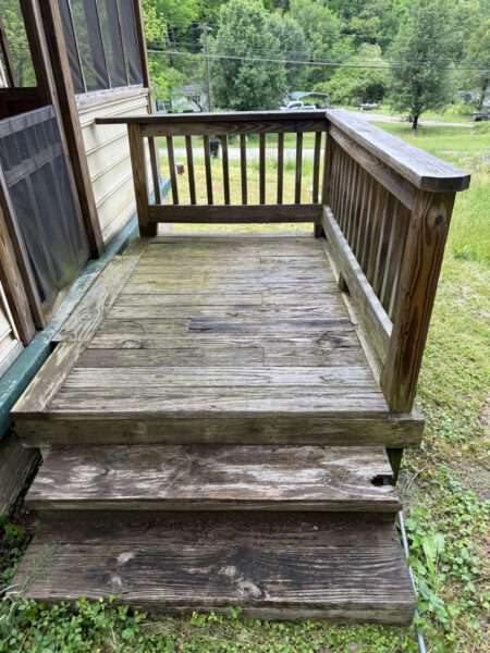This project involved a comprehensive low-pressure soft wash of a single-story home's exterior surfaces, including siding, trim, and gutters, to remove organic growth and restore a uniform appearance.