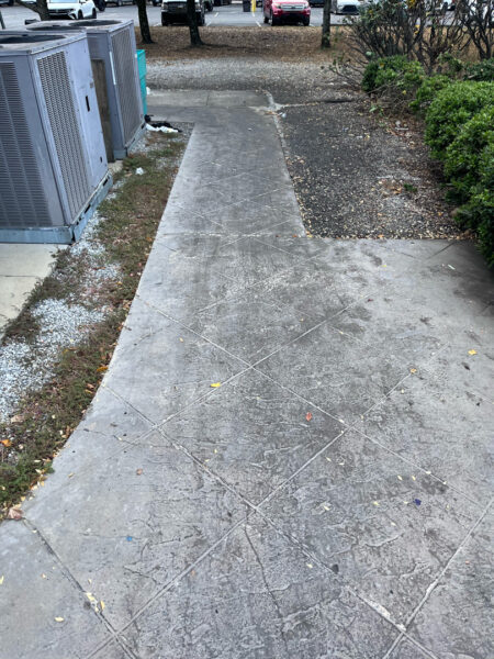 The project at Urban Stack in Chattanooga involved inspecting and thoroughly pressure washing the restaurant's exterior sidewalks, dining patios, and side entrance to remove dirt, stains, and grease, thereby restoring a clean appearance and improving pedestrian safety.