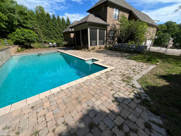 This project involved restoring a patio's appearance through a thorough, chemical-free pressure washing process that removed weeds, organic growth, and debris to refresh the natural color of the hardscape.