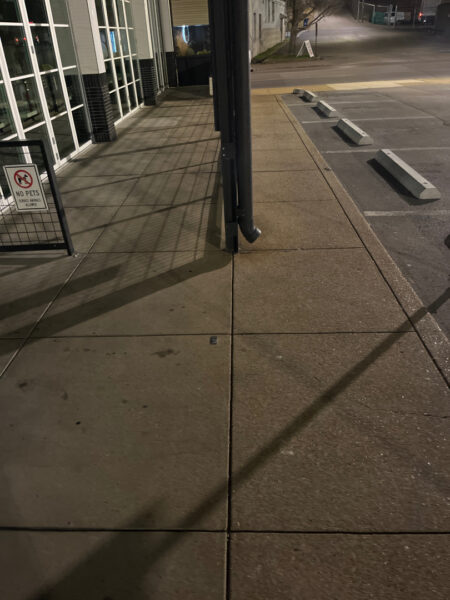 The front patio concrete at Milk and Honey was professionally restored through a multi-step process involving site protection, specialized detergent application, targeted pressure washing, and a final rinse to remove organic growth and grease.