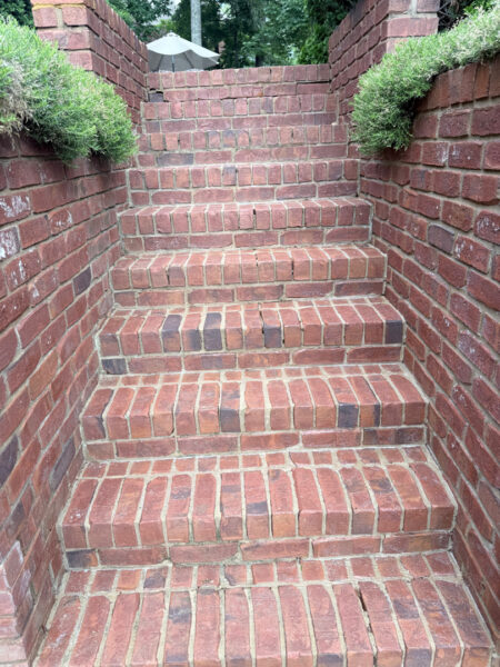 Professional cleaning and pressure washing were performed on a concrete pool deck and a retaining wall in Chattanooga to remove mold, mildew, and grime through the application of specialized detergents and methodical surface washing.