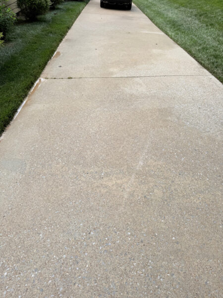 The team performed a targeted soft-wash of the front porches, vertical surfaces, and brick steps of a one-story residence in Chattanooga, complemented by a professional surface cleaning of the driveway, sidewalk, and walkways to enhance curb appeal.