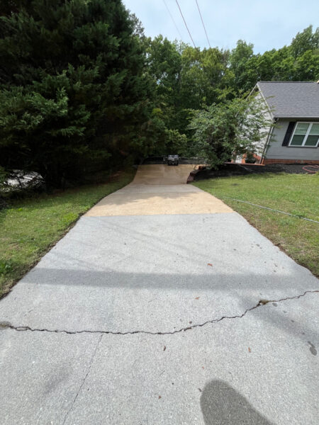 This comprehensive exterior cleaning project involved a full soft wash of the home's surfaces, a dedicated pressure wash of concrete hardscapes and retaining walls, and a gentle cleaning of the wood deck and mailbox to remove organic growth and restore the property's appearance.