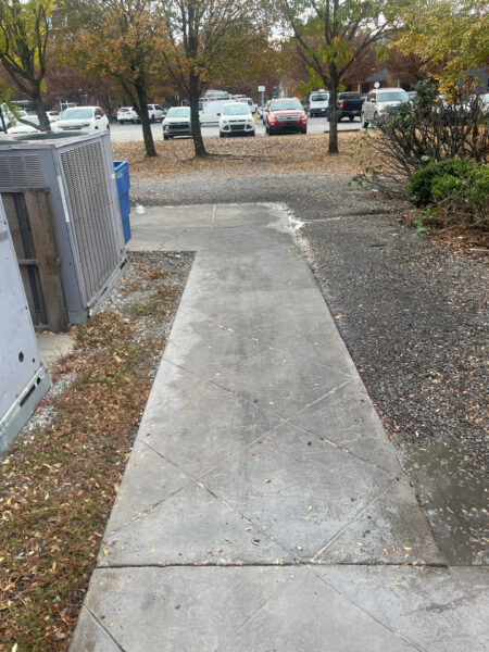 The project at Urban Stack in Chattanooga involved inspecting and thoroughly pressure washing the restaurant's exterior sidewalks, dining patios, and side entrance to remove dirt, stains, and grease, thereby restoring a clean appearance and improving pedestrian safety.