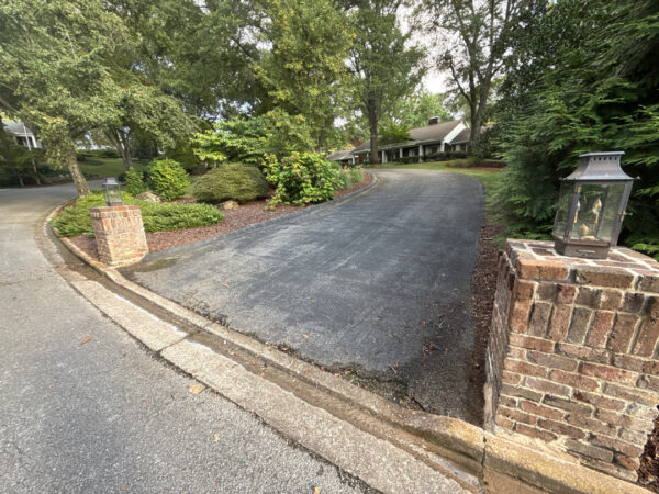 This project involved a comprehensive soft wash and detailed exterior cleaning of a Chattanooga residence, encompassing the house, porches, concrete surfaces, gutters, and outbuildings to remove organic buildup and restore a uniform appearance.