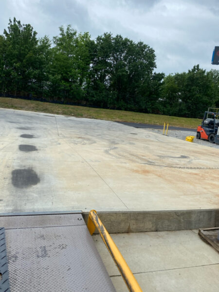 Professional surface washing and detergent treatment were performed on the concrete entrance and exit pads of a commercial scale in Chattanooga to remove organic buildup while strictly adhering to site-specific exclusion zones.