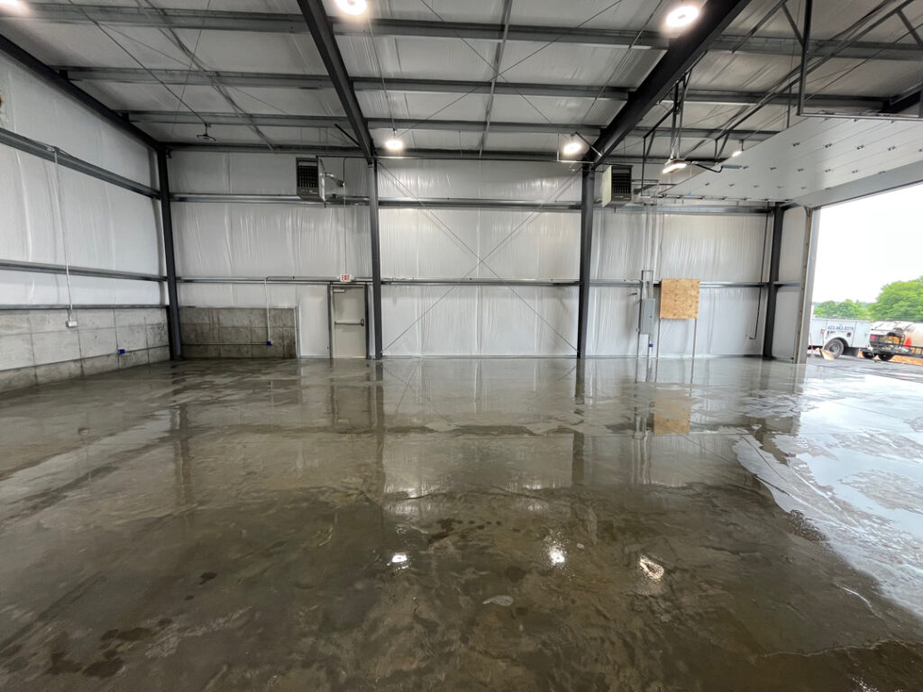 A cleaning of this metal warehouse to remove built-up dirt, grime, and surface staining was done, leaving the slab noticeably cleaner, brighter, and more professional-looking. The wash improved the overall appearance of the space while helping reduce slick residue and making the floor easier to maintain going forward.