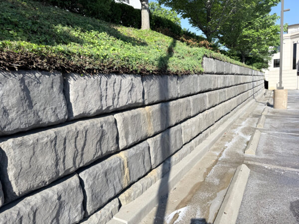 This project in Chattanooga utilized specialized soft wash and surface cleaning techniques to remove organic growth and contaminants from a retaining wall and street light concrete bases while preserving the structural integrity of the masonry.