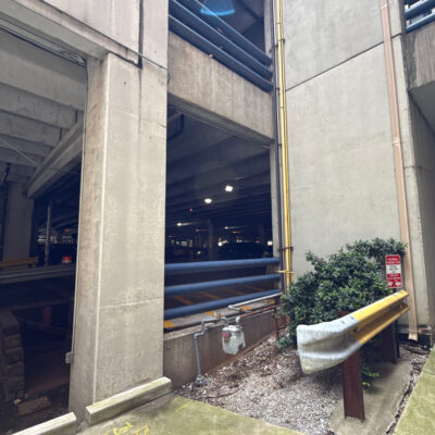 This project encompassed an exterior refresh of a Chattanooga commercial property through power washing structural surfaces, repainting pedestrian bridge handrails, pressure washing concrete areas, and hand-cleaning second-story windows.