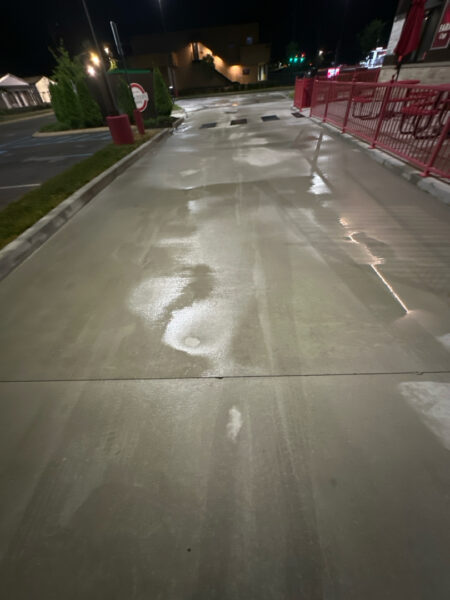 This commercial exterior restoration project in Ooltewah revitalized the property's curb appeal by thoroughly cleaning the building's facade, awnings, drive-thru lane, dumpster pad, and parking areas to remove heavy grime, stains, and organic buildup.