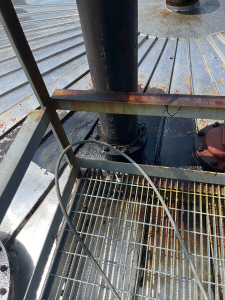 This project involved the complete cleaning and surface preparation of two industrial storage tanks' tops and upper walls using a 40-foot electric lift, pressure washing, and specialized detergents to remove mold, mildew, and dirt.