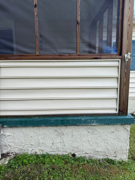 This project involved a comprehensive low-pressure soft wash of a single-story home's exterior surfaces, including siding, trim, and gutters, to remove organic growth and restore a uniform appearance.