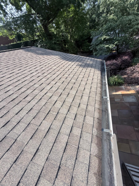 This project involved a comprehensive exterior refresh of a Chattanooga home using soft washing and surface cleaning to safely remove dirt, mold, and residue from the siding, gutters, porches, concrete walkways, brick retaining walls, entryway columns, wooden swing, and stone pool deck.