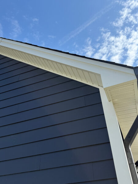 A two-story home in Cleveland, TN, received a comprehensive soft wash cleaning of its vertical surfaces, gutters, and trim, backed by a one-year warranty against mold and mildew regrowth.